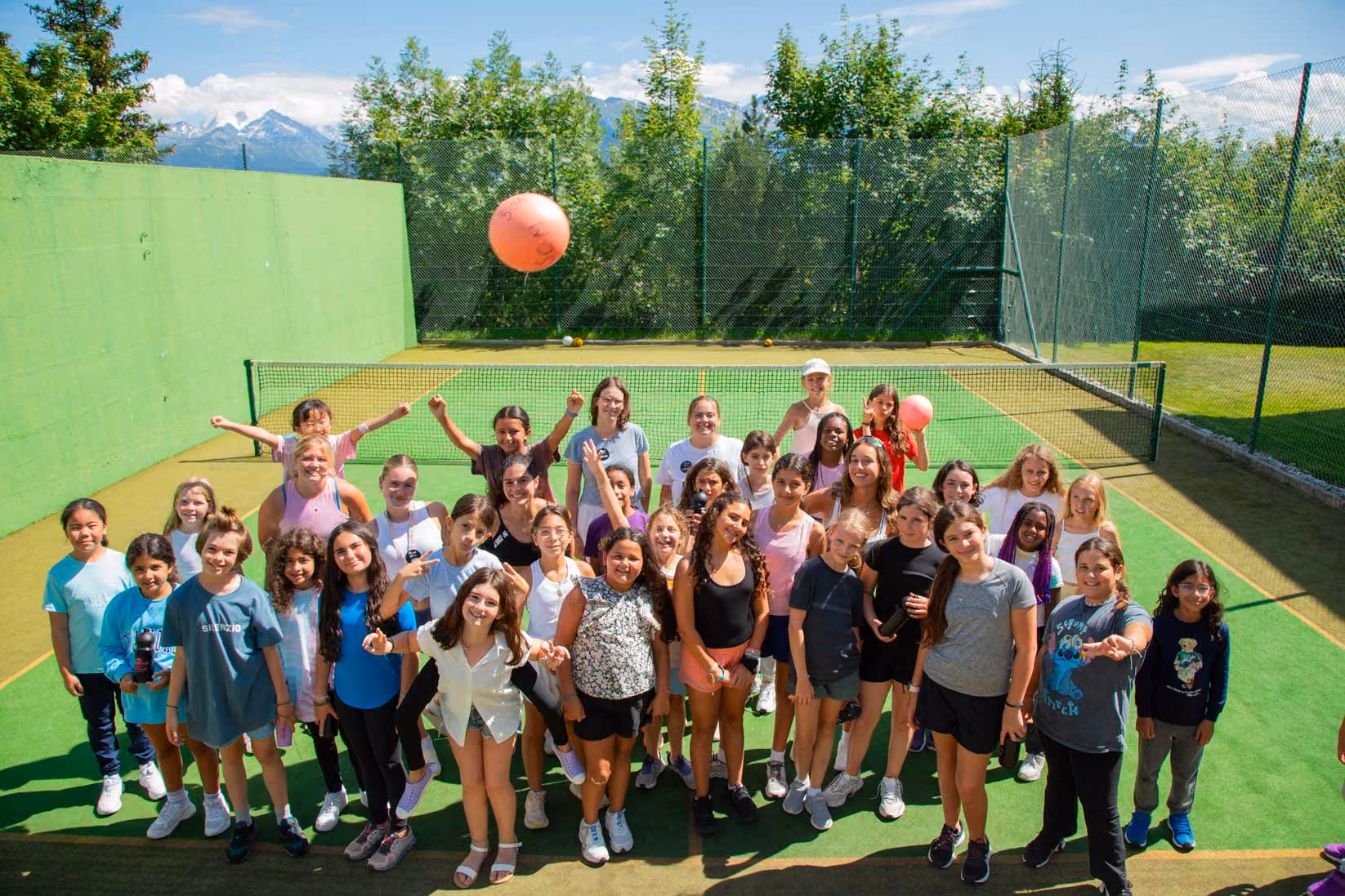 Young people playing volleyball