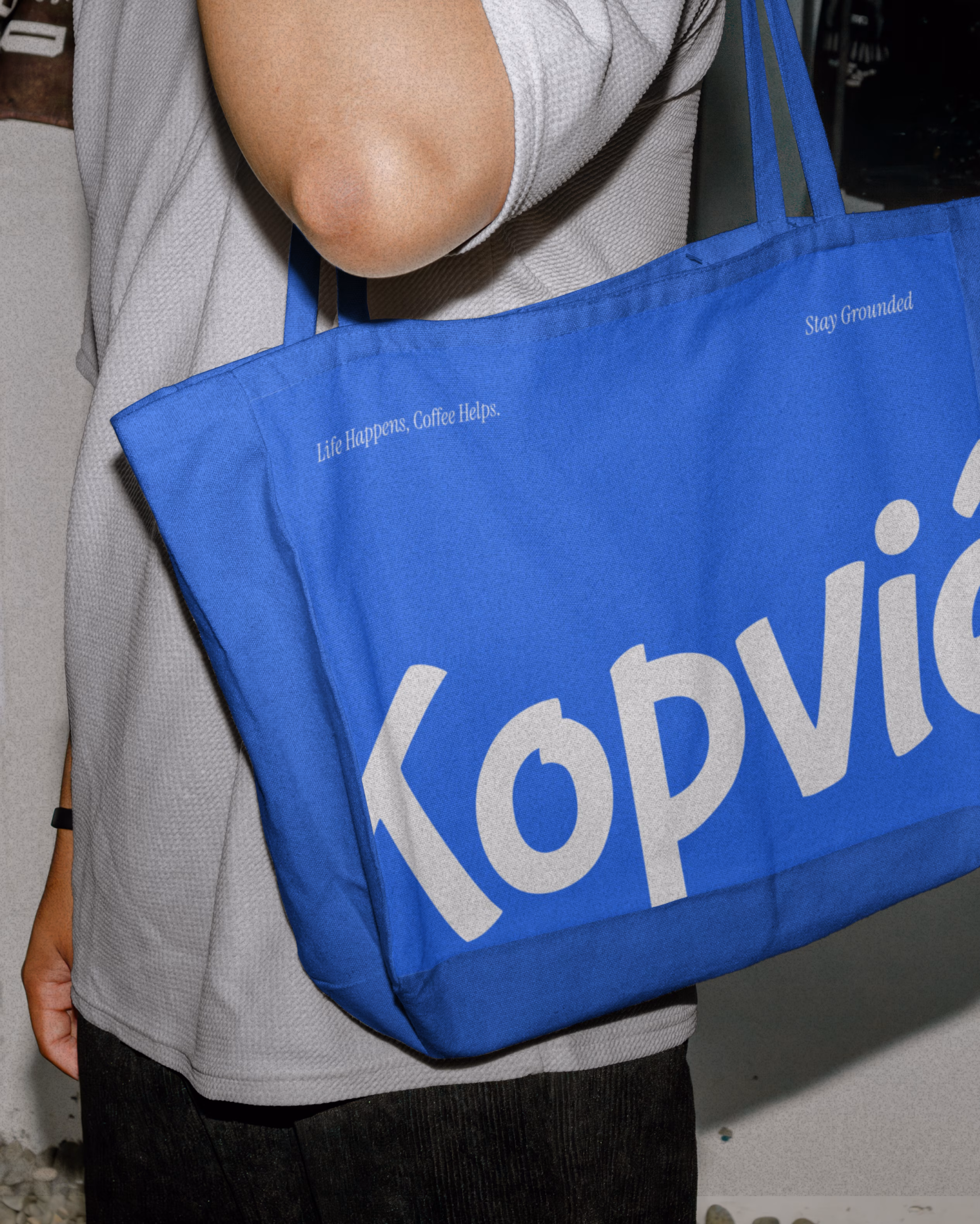 Kopvié merchandise bag featuring bold typography and color system