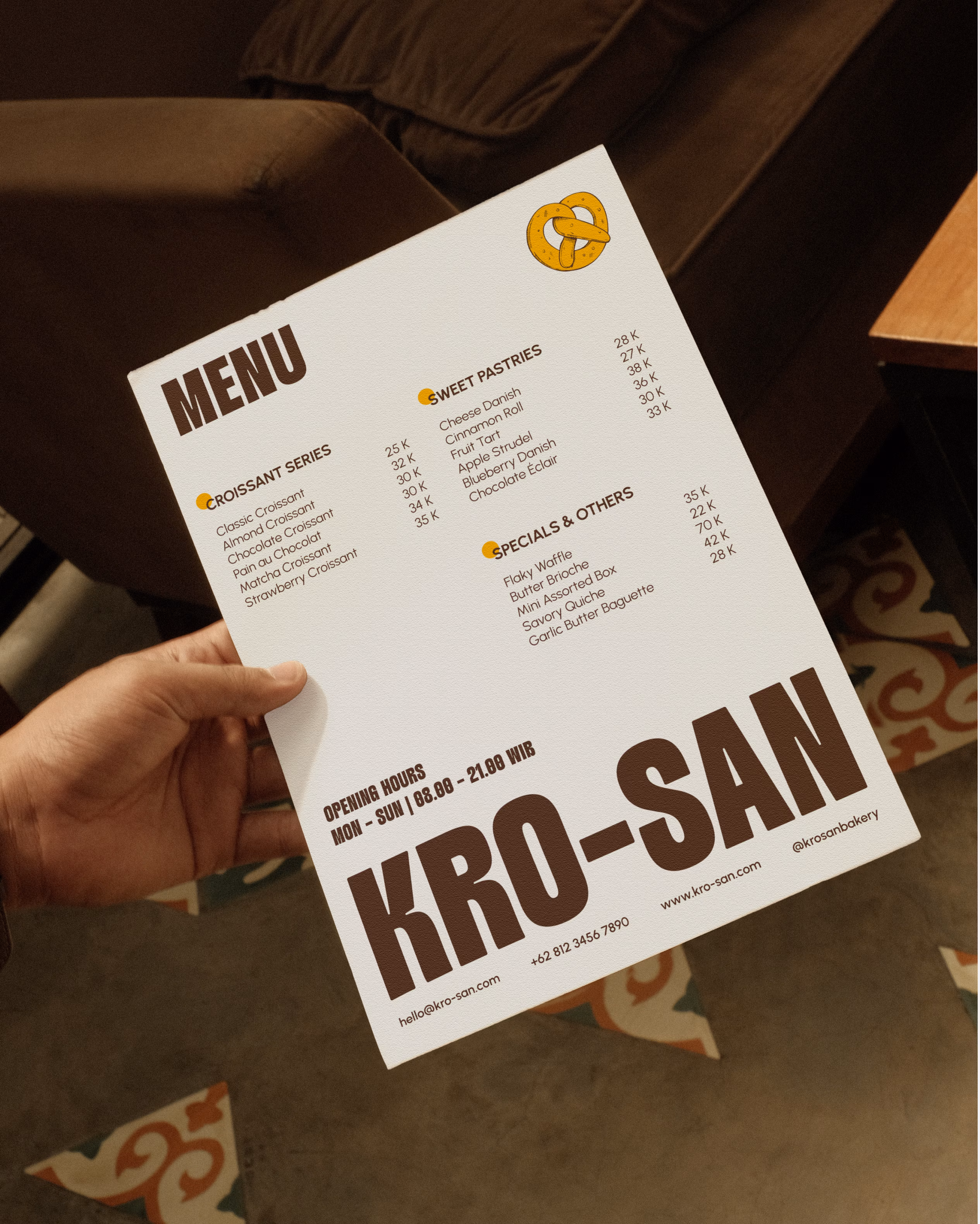 Krosan Bakery menu card displaying croissants, sweet pastries, and pricing