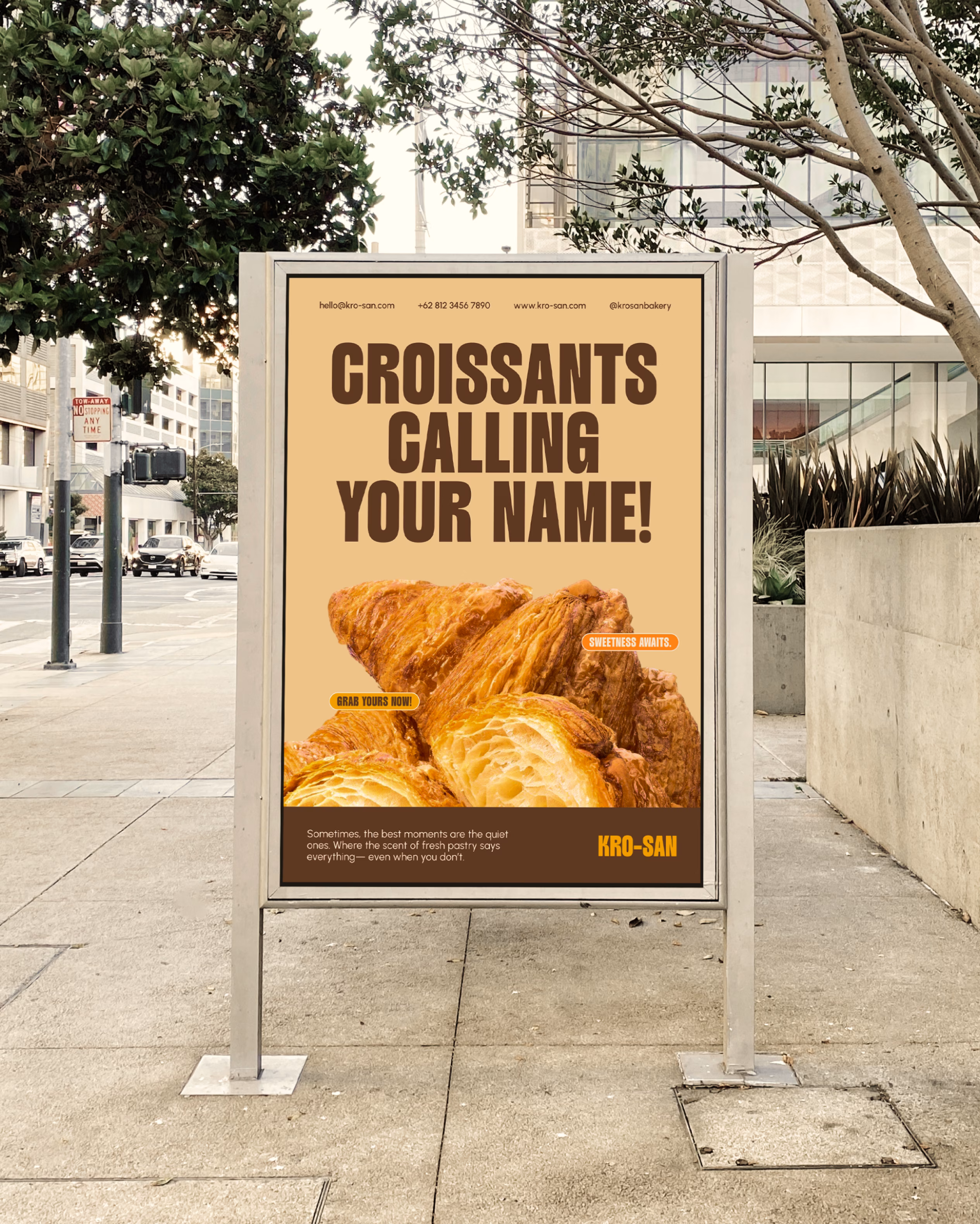 Krosan street billboard advertisement showing croissants and call-to-action messaging