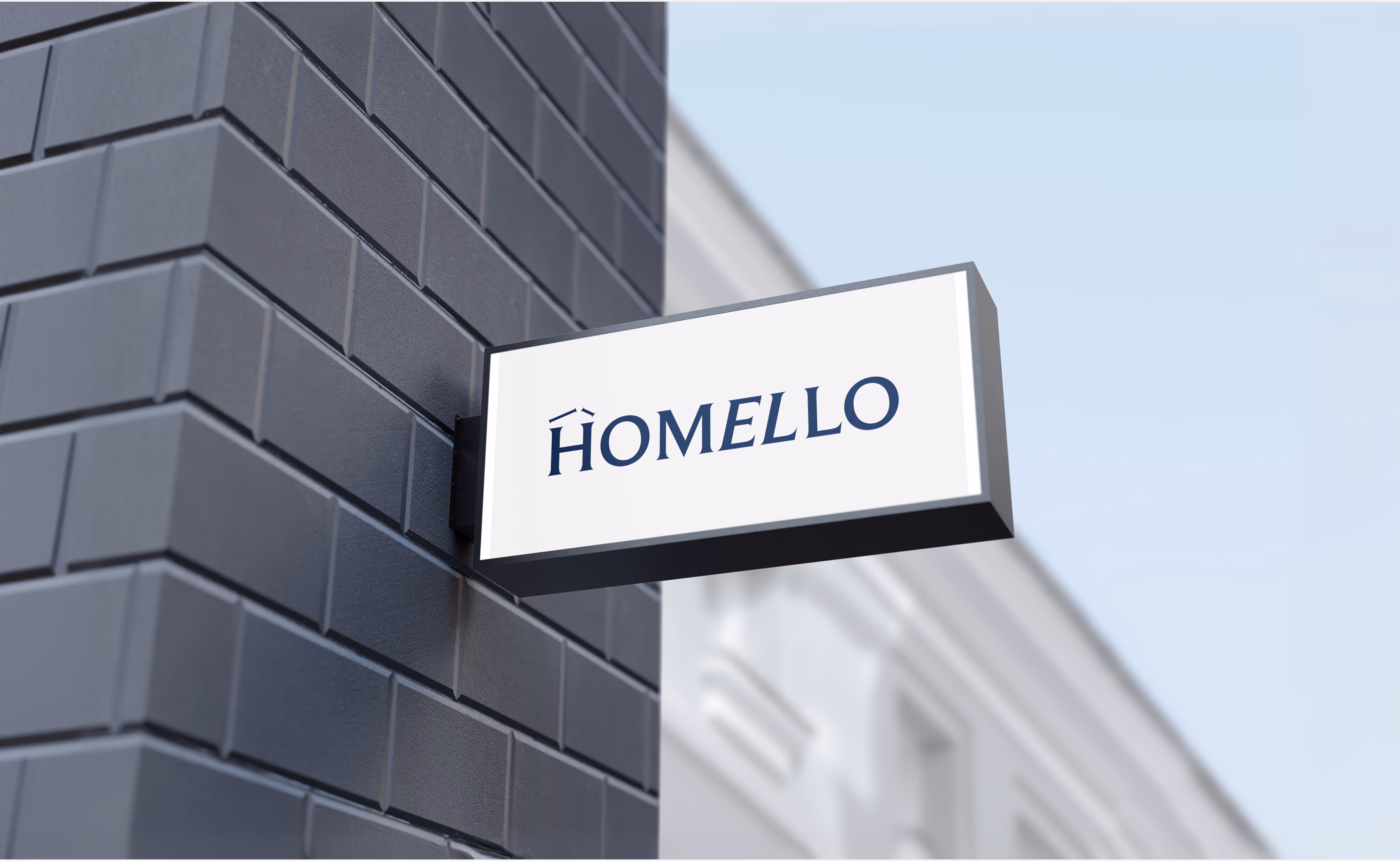 Homello storefront branding showing building signage for Auckland-based hospitality property management company by Hatypo Studio