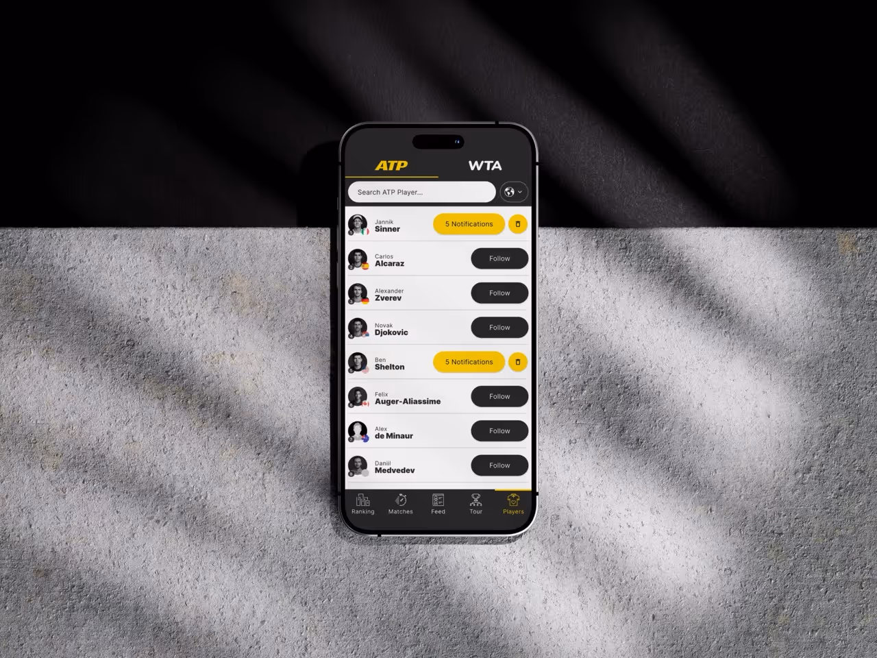 Mobile tennis app showing player search and follow options with notifications for some players.