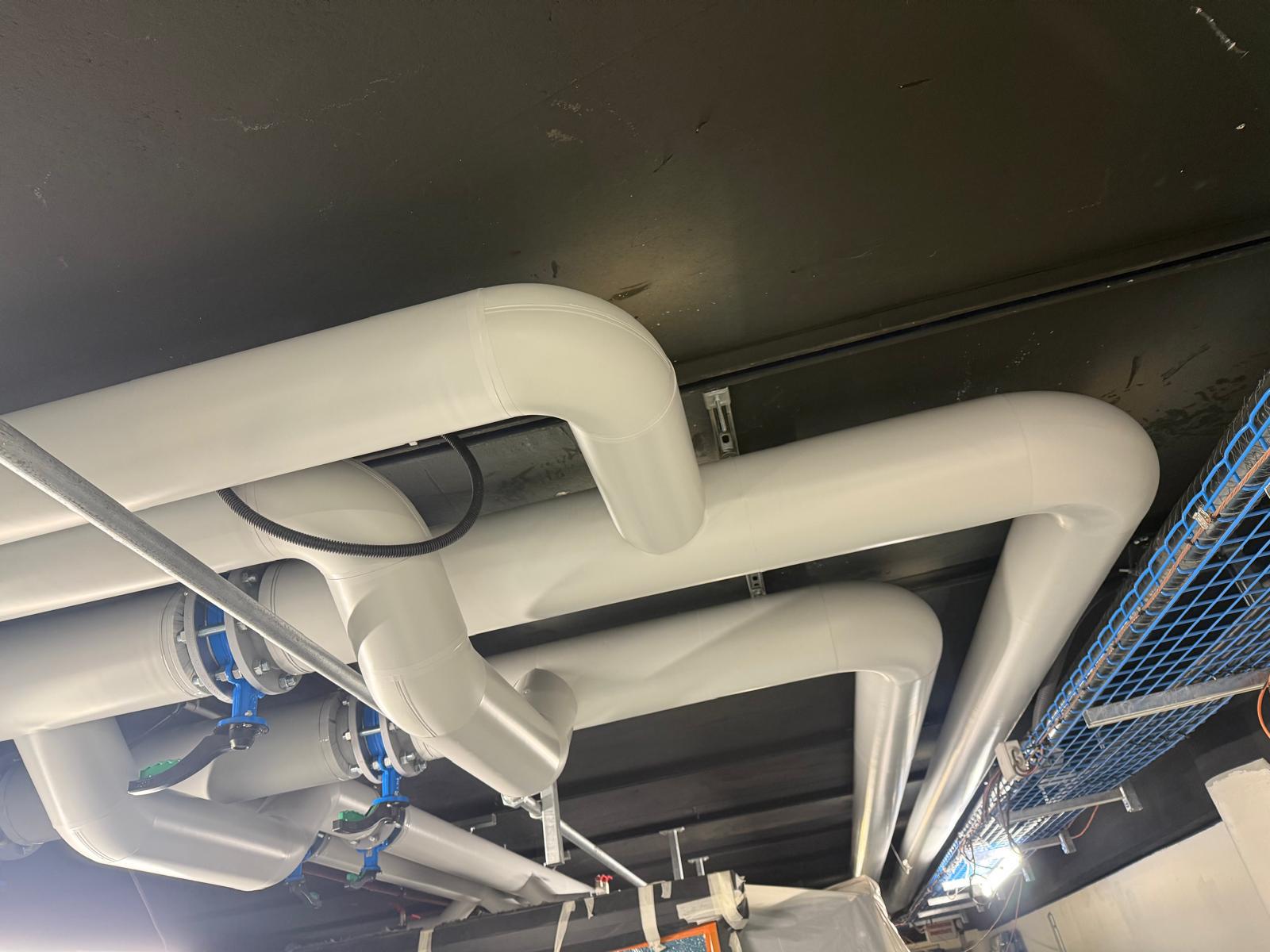 [background image] image of pipes and fittings (for a plumbing service)