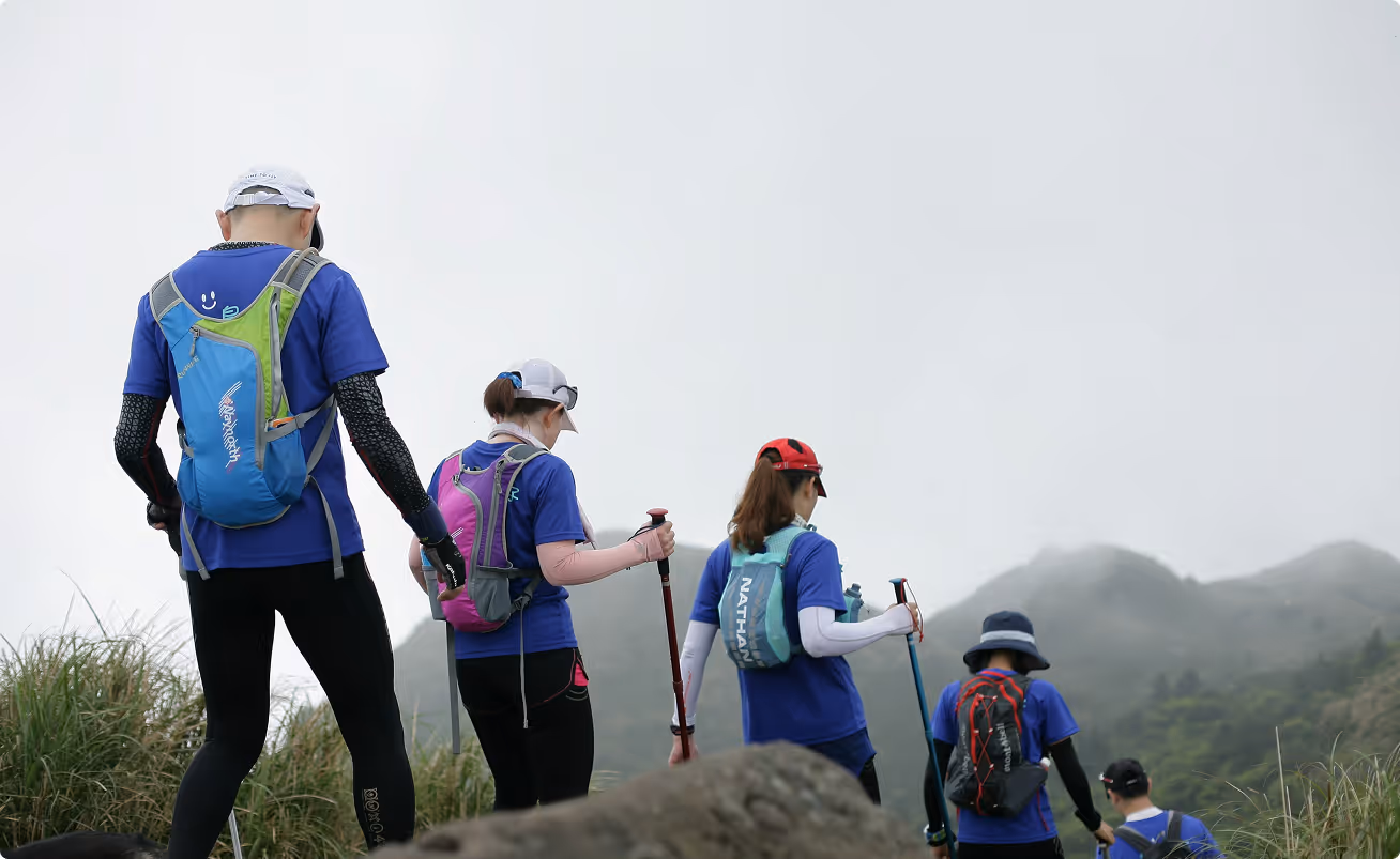 Group of people hiking on a mountain trail