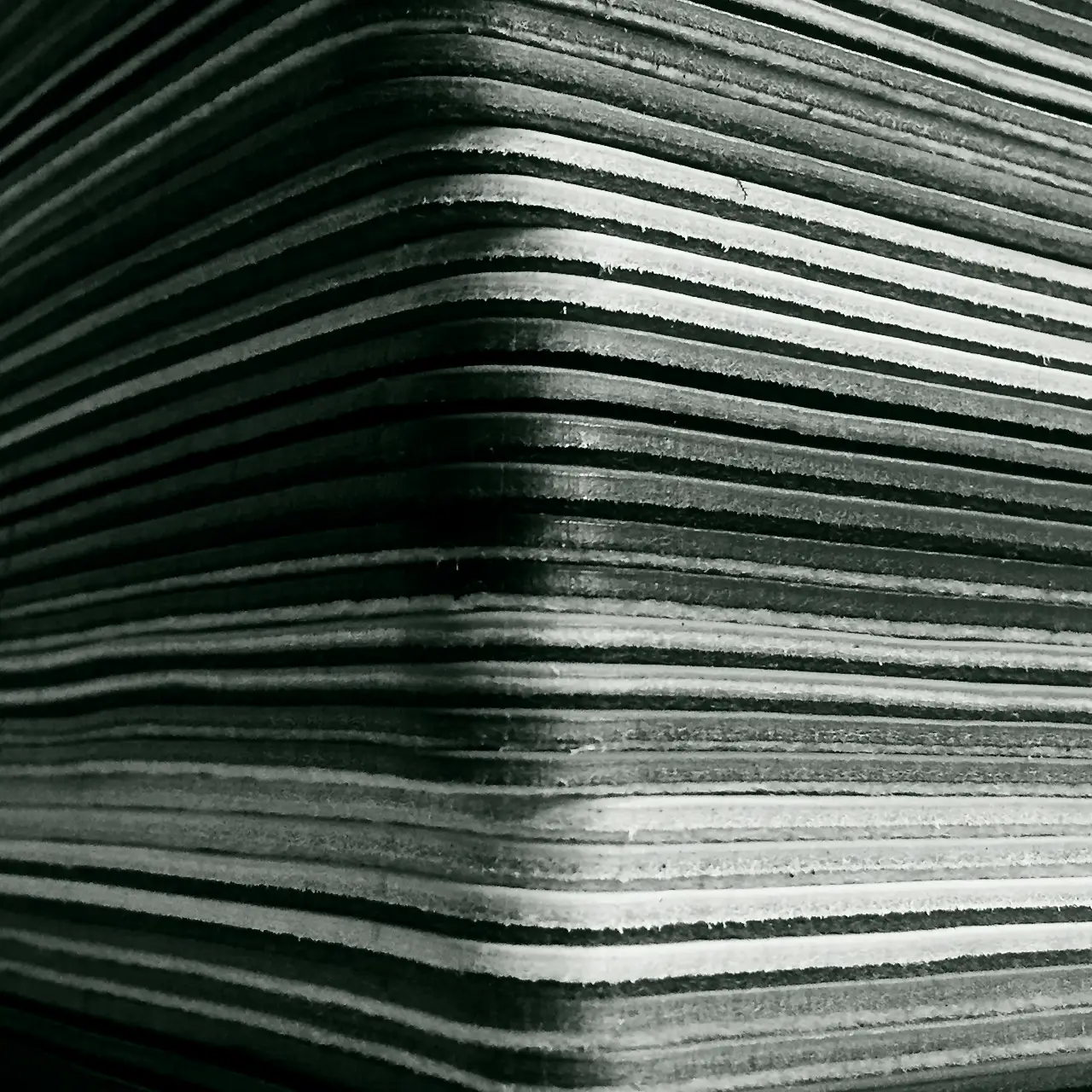 a stack of leather coasters for a retail display showing a variety of colours