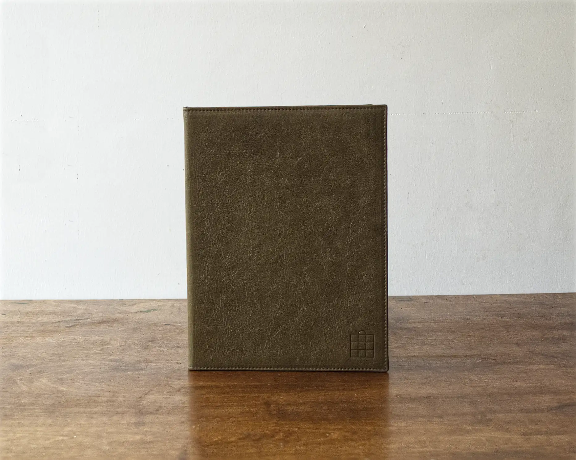A leather menu made from upholstery leather to match the restaurant interior