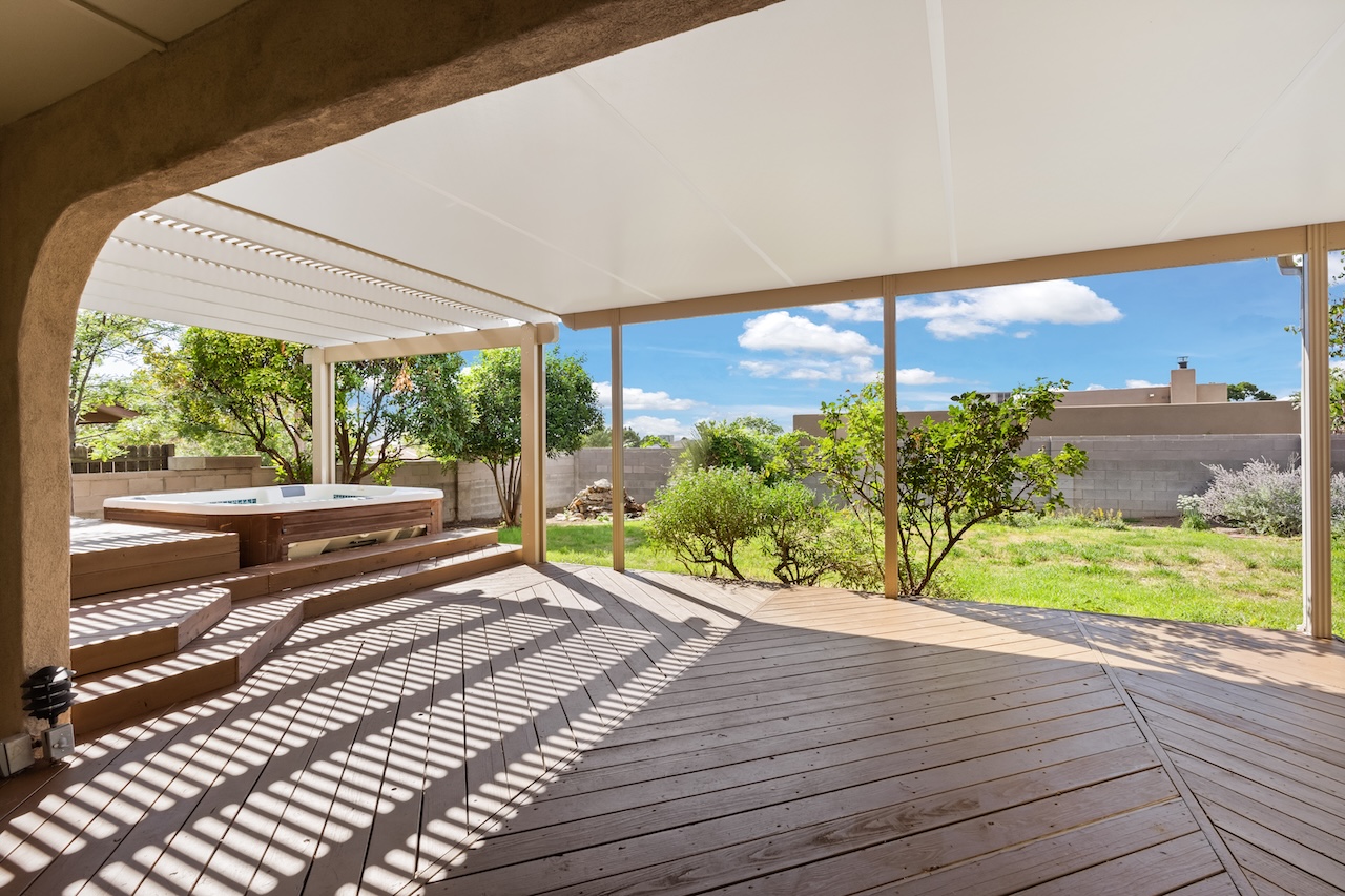 Combination solid and open roof pergola at Northeast Heights home