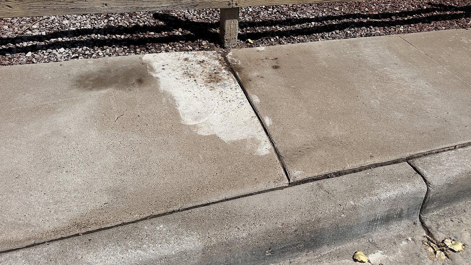 Finished sidewalk joint after concrete grinding in Albuquerque
