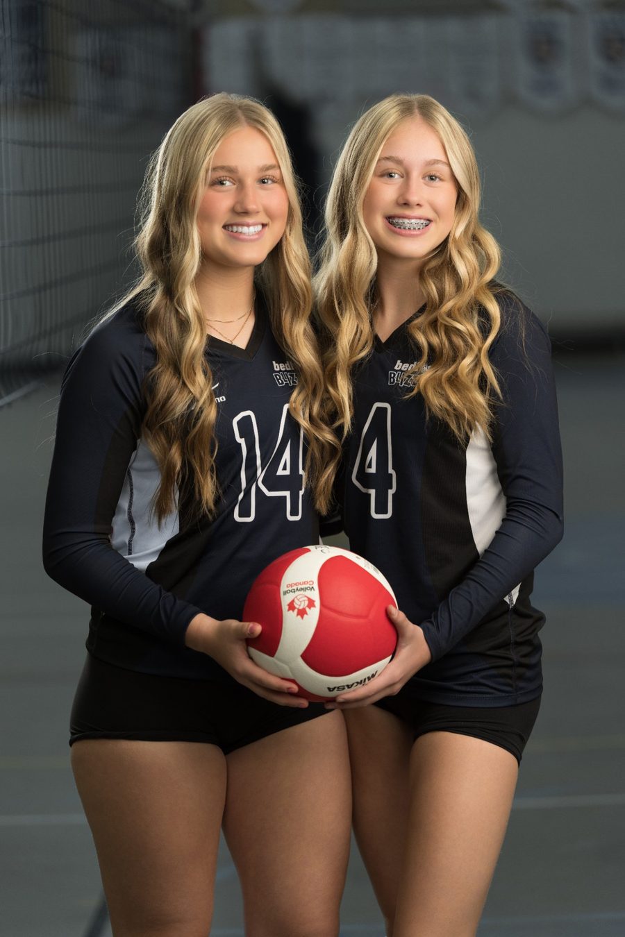 Two volleyball players posed together