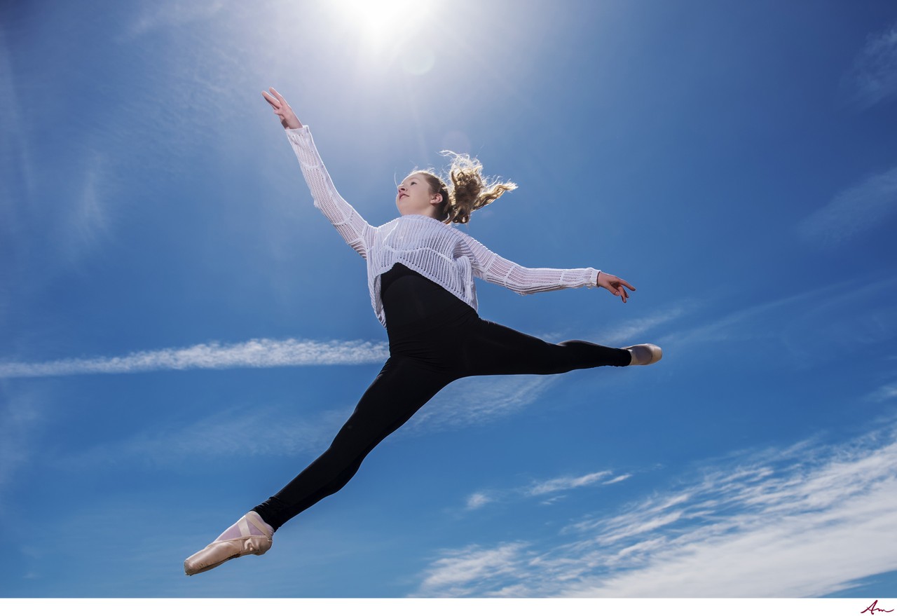 Dancer leaping against a blue sky for the Sunshine Foundation, Eastern Passage
