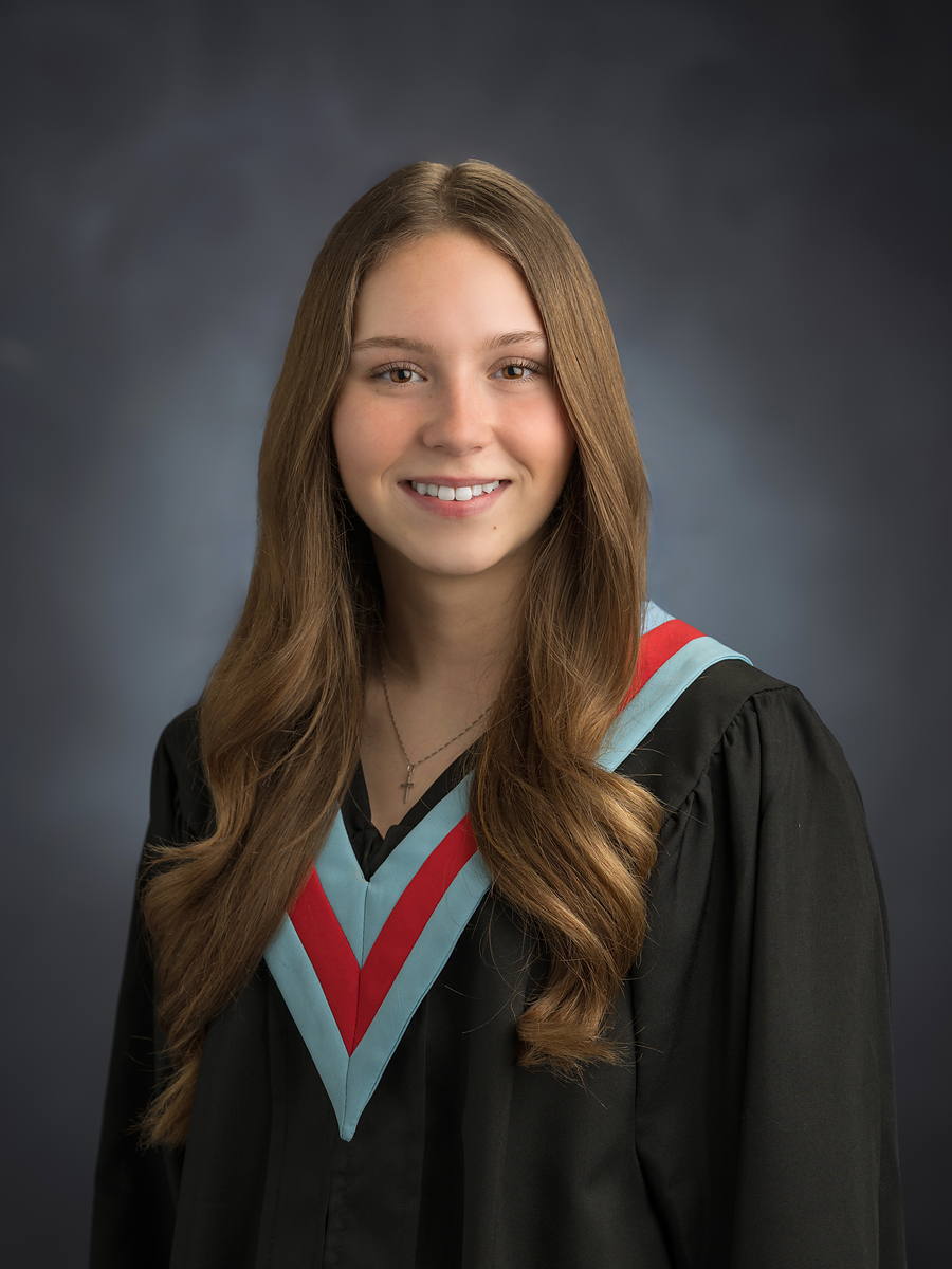 Bay View High grad with long brown hair in a black gown with light blue and red sash, Halifax