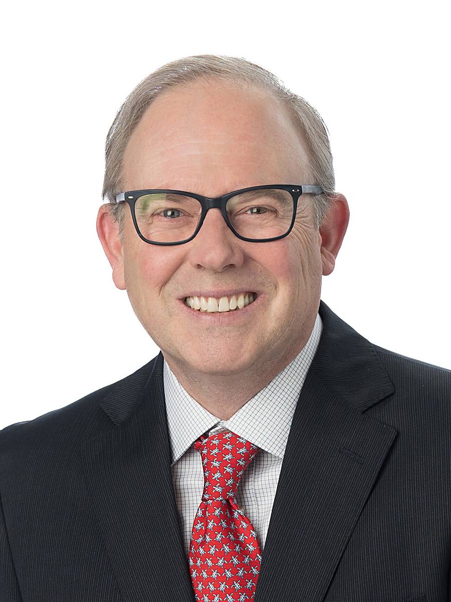 Headshot of CTV News Atlantic anchor Todd Battis in a pinstripe suit and red tie, Halifax studio