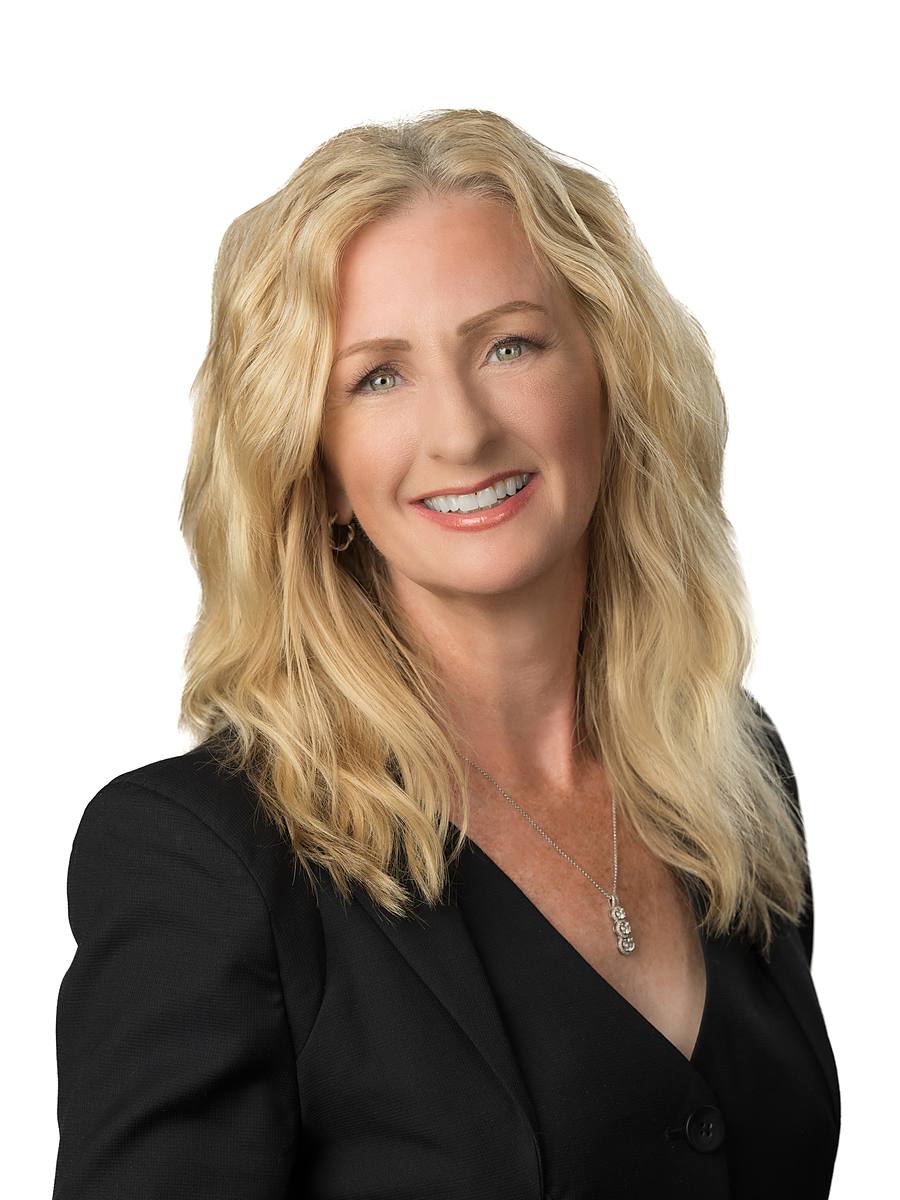 Headshot of CTV Atlantic's Liz Rigney in a black blazer, Halifax studio portrait