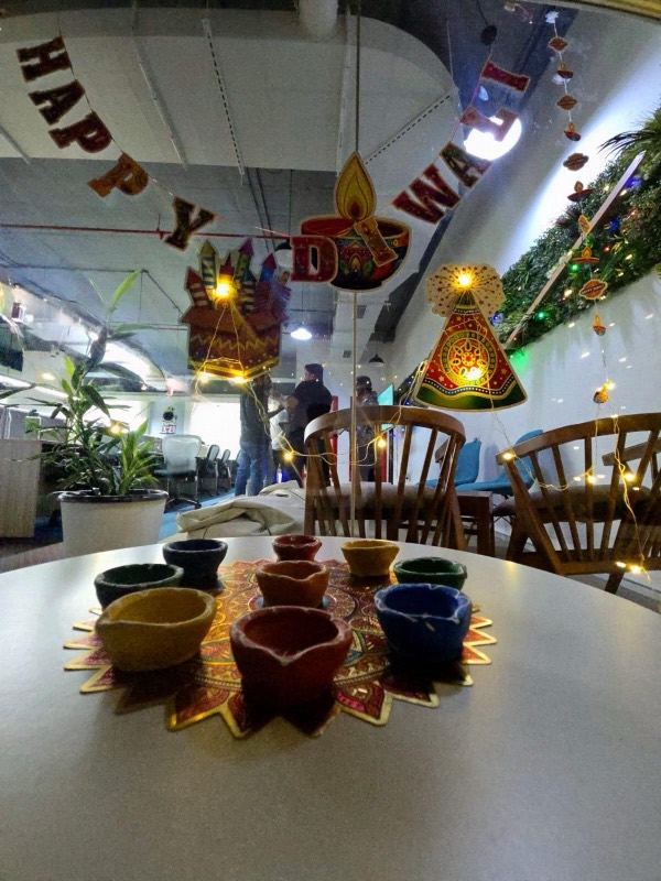 The office decorated for Diwali with a Happy Diwali banner, lanterns and fairy lights
