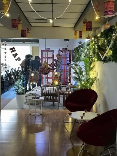 The office breakout area decorated with festival lanterns and greenery