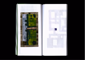 Open book with pixelated abstract images on both pages against a black background.