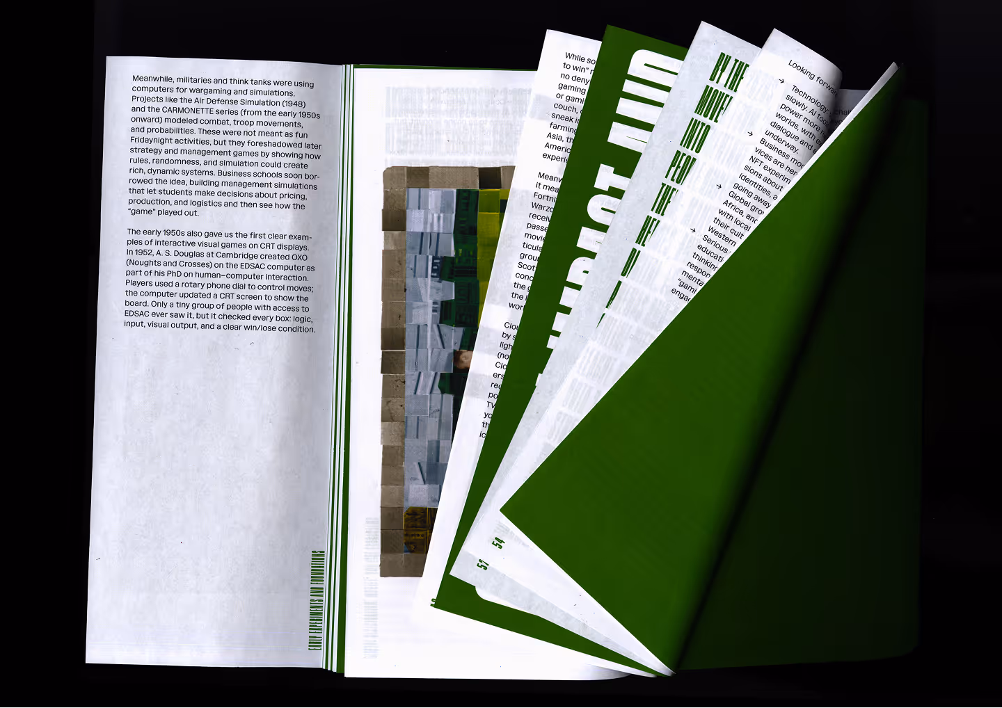 Open magazine with pages fanning out, containing text, green headers, and illustrations.