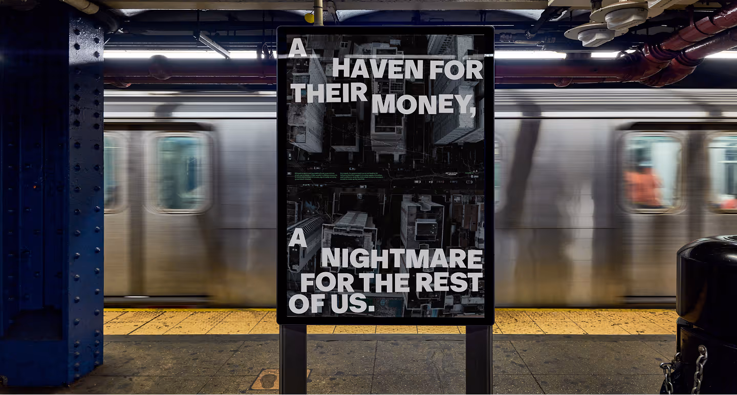 Subway station platform with motion-blurred train and a billboard reading: A haven for their money, a nightmare for the rest.