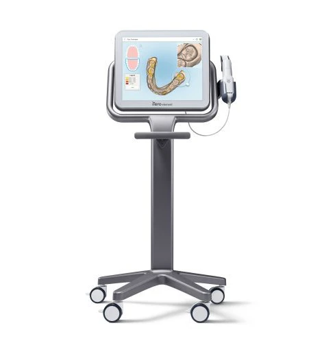 iTero dental scanner on a mobile stand showing a 3D digital model of teeth on its screen.