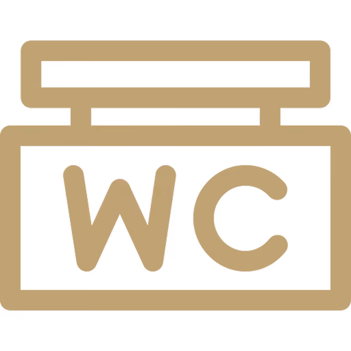 Simple beige WC restroom sign with block letters inside a rectangular border.