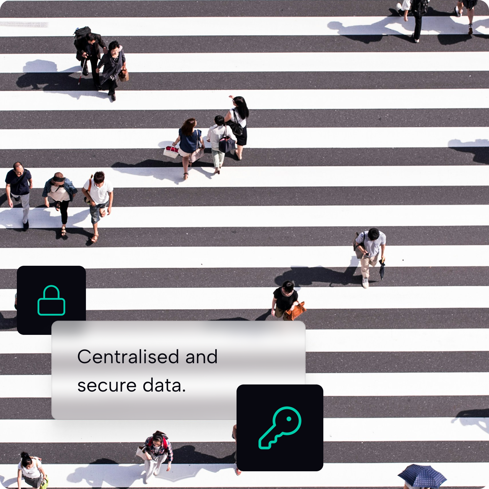 Aerial view of pedestrians crossing a street, with a centralised and secure data overlay and lock and key icons.