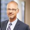 View John A. Fabello Biography on their website