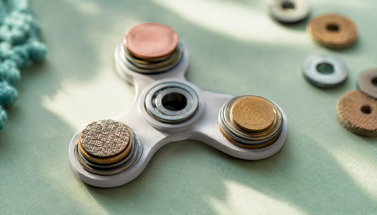 Close-up of weighted fidget spinner prongs