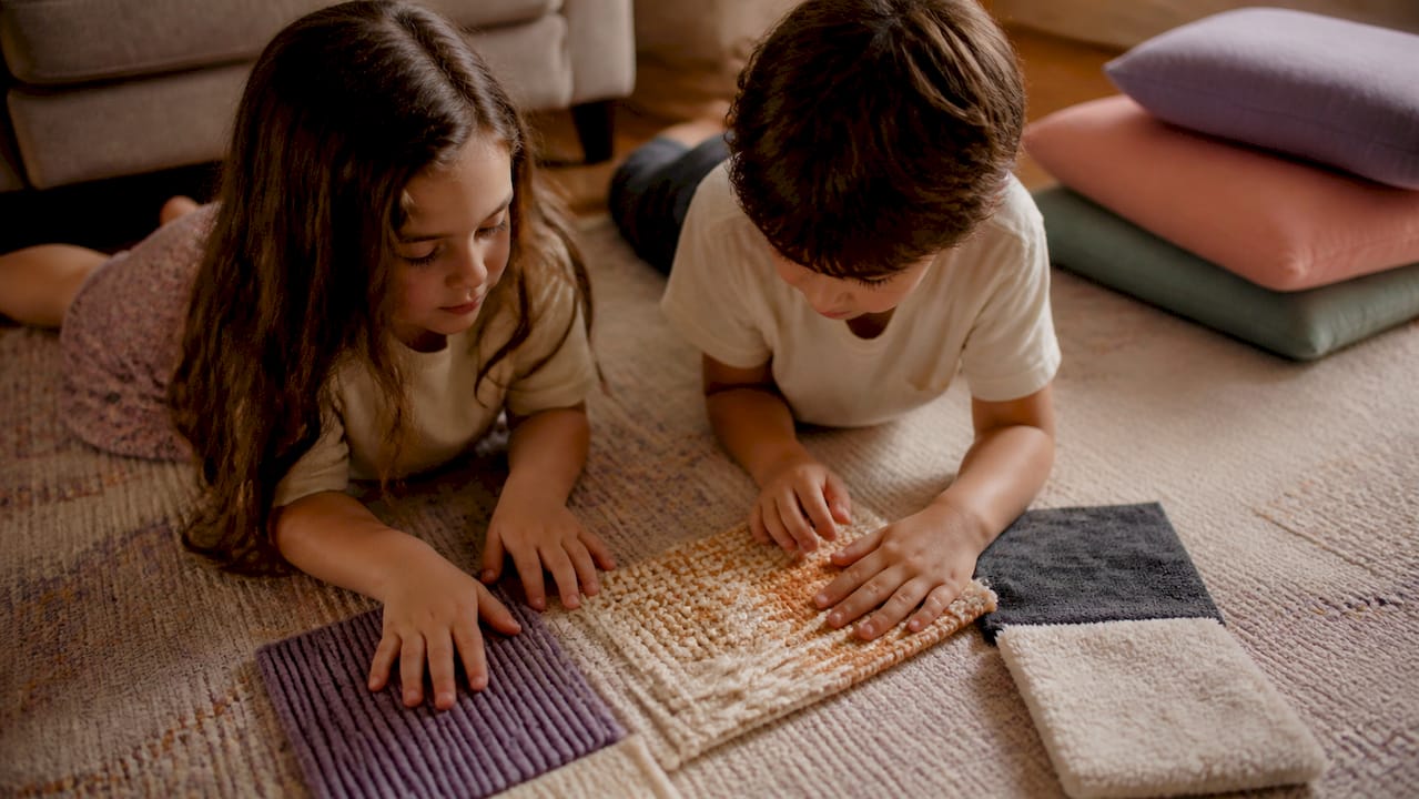 Siblings playing tactile sensory activity together