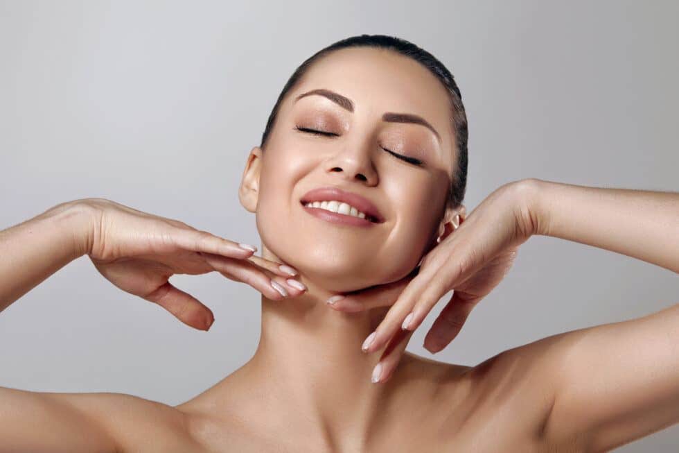 woman showing off face after treatment