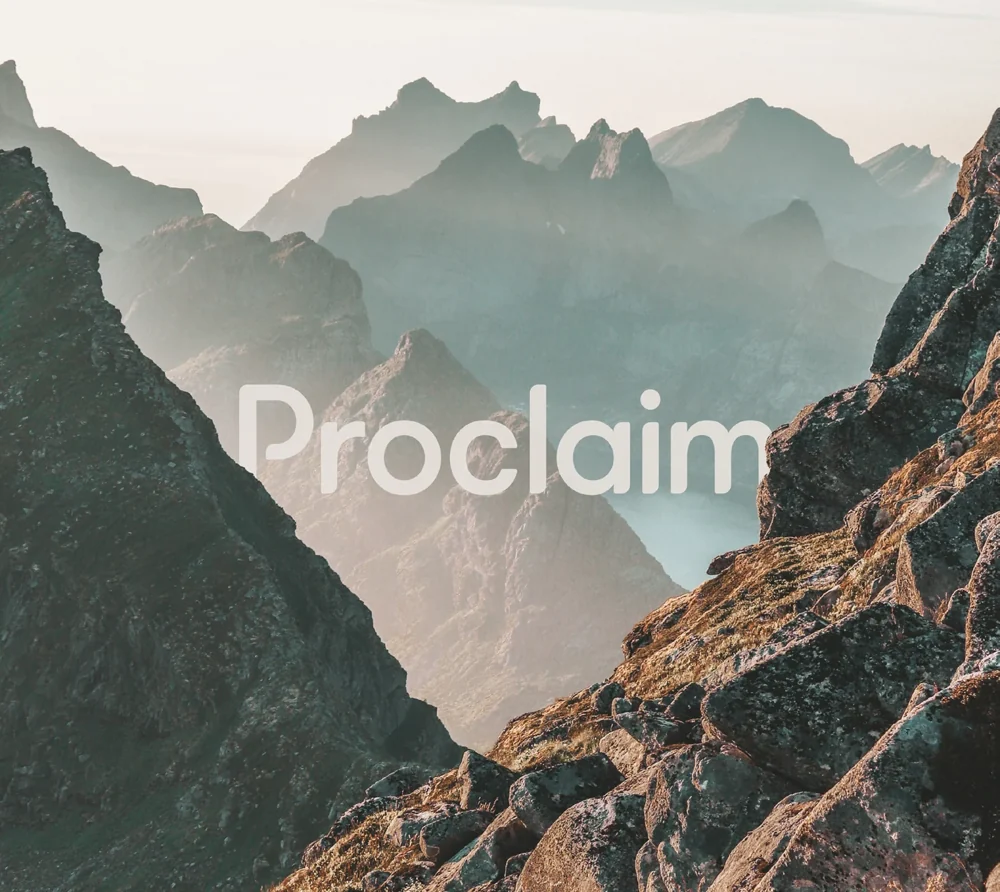 Proclaim wordmark over a mountain landscape