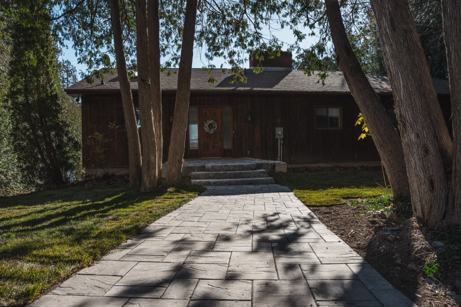 Interlocking paver walkway leading to a cottage entrance in Kawartha Lakes by TEG Contracting