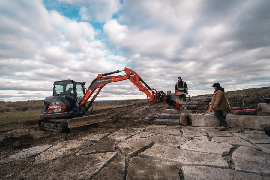 Excavation and natural stone install for a backyard outdoor living space in the Kawartha Lakes area by TEG Contracting
