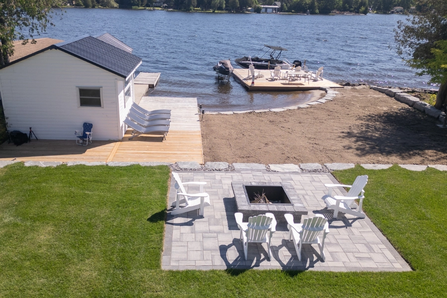 Interlocking paver patio with fire pit at a Kawartha Lakes waterfront property by TEG Contracting