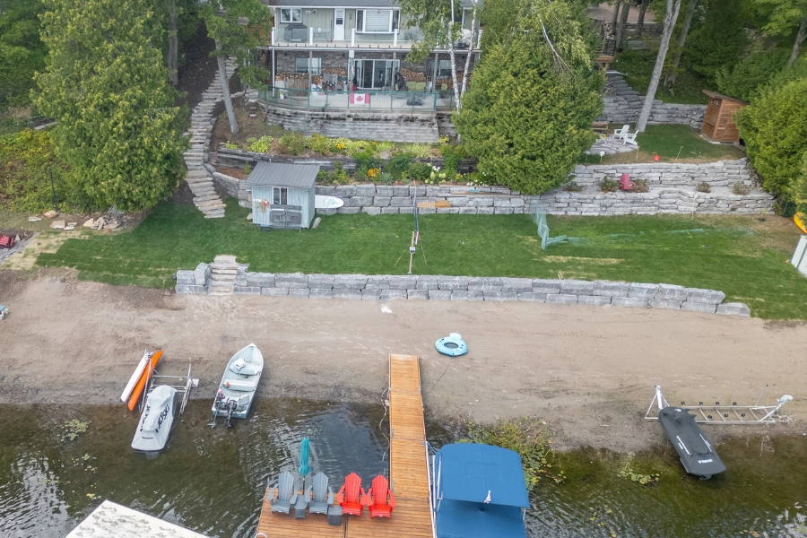 Aerial view of a natural stone shoreline retaining wall on a Kawartha Lakes waterfront by TEG Contracting