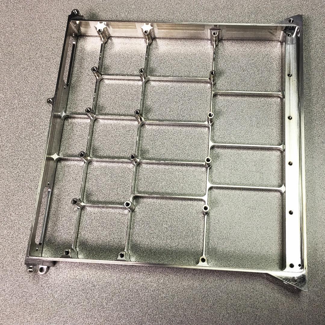 Machined stainless steel part produced with design-for-manufacturability optimization