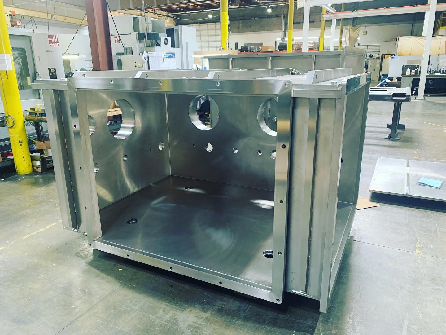Heavy component handling during assembly at IMT Precision's 50,000 sq ft facility