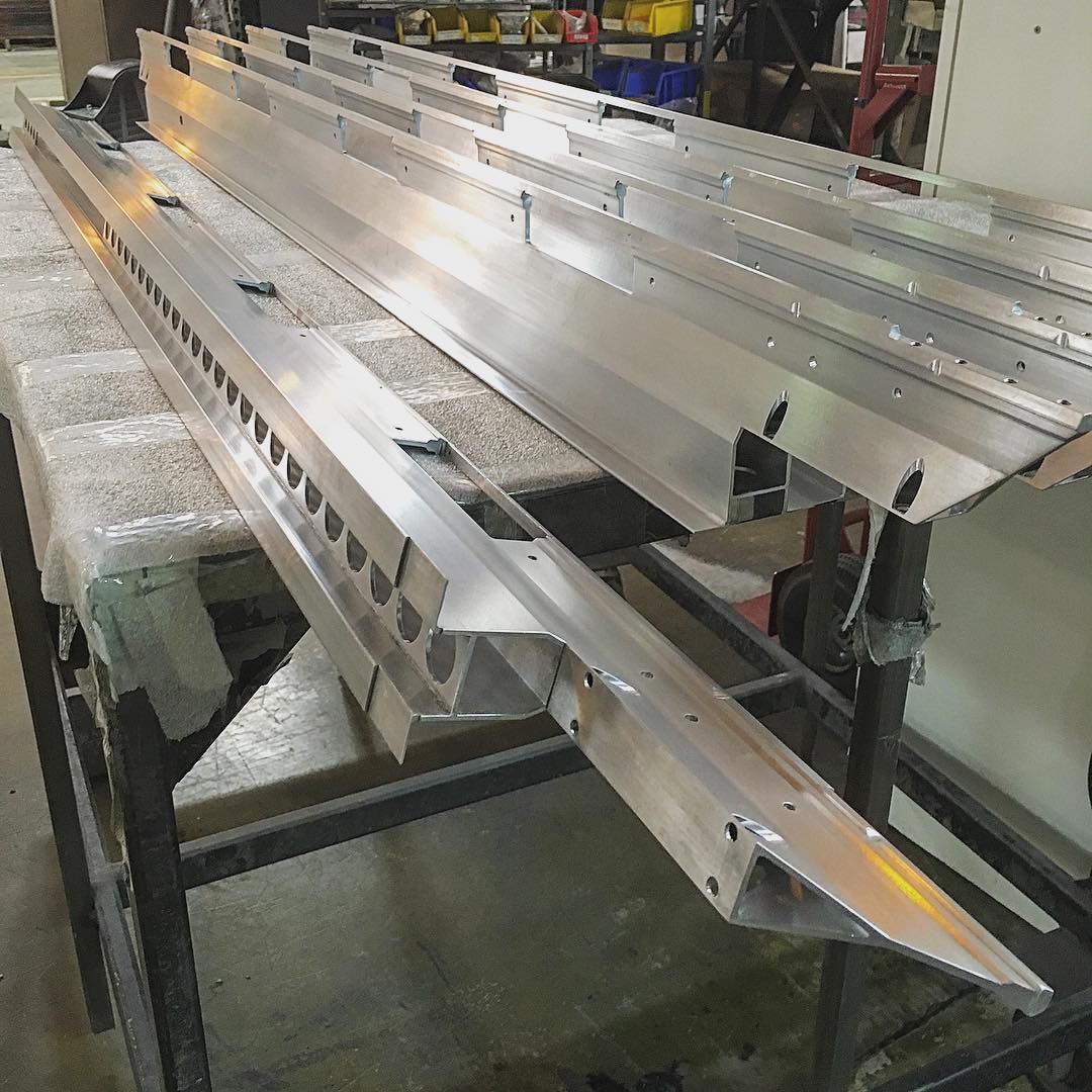 Large mechanical assembly in progress on IMT Precision's production floor