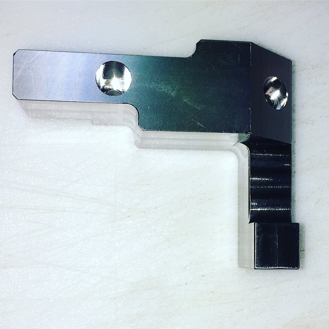 Faro Quantum M portable arm inspecting oversized machined component