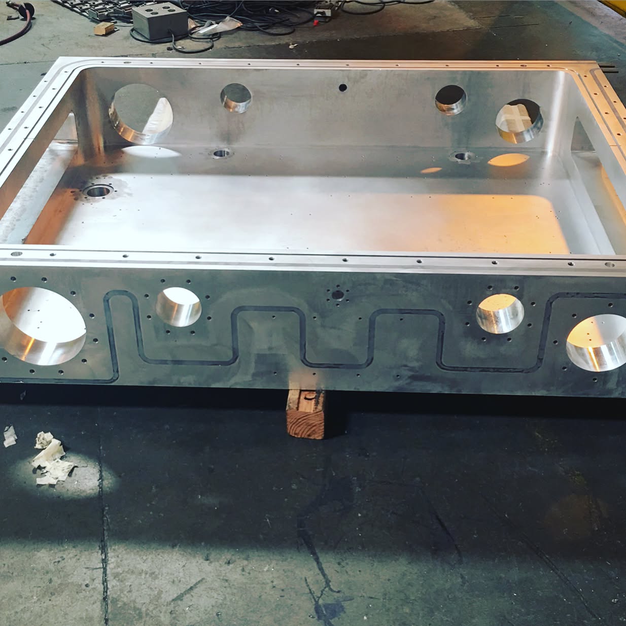 Machined aluminum part with precision bore features