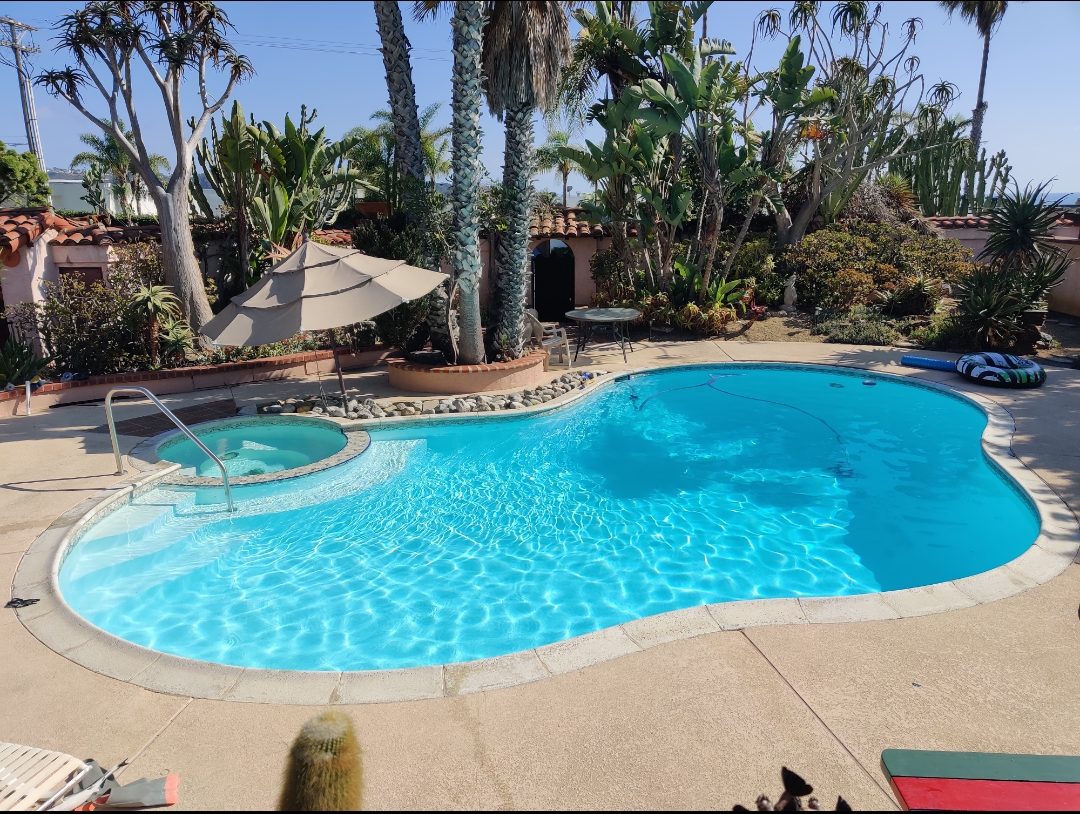 A beautiful swimming pool in Del Mar that has been treated by Beachside Pool Service.