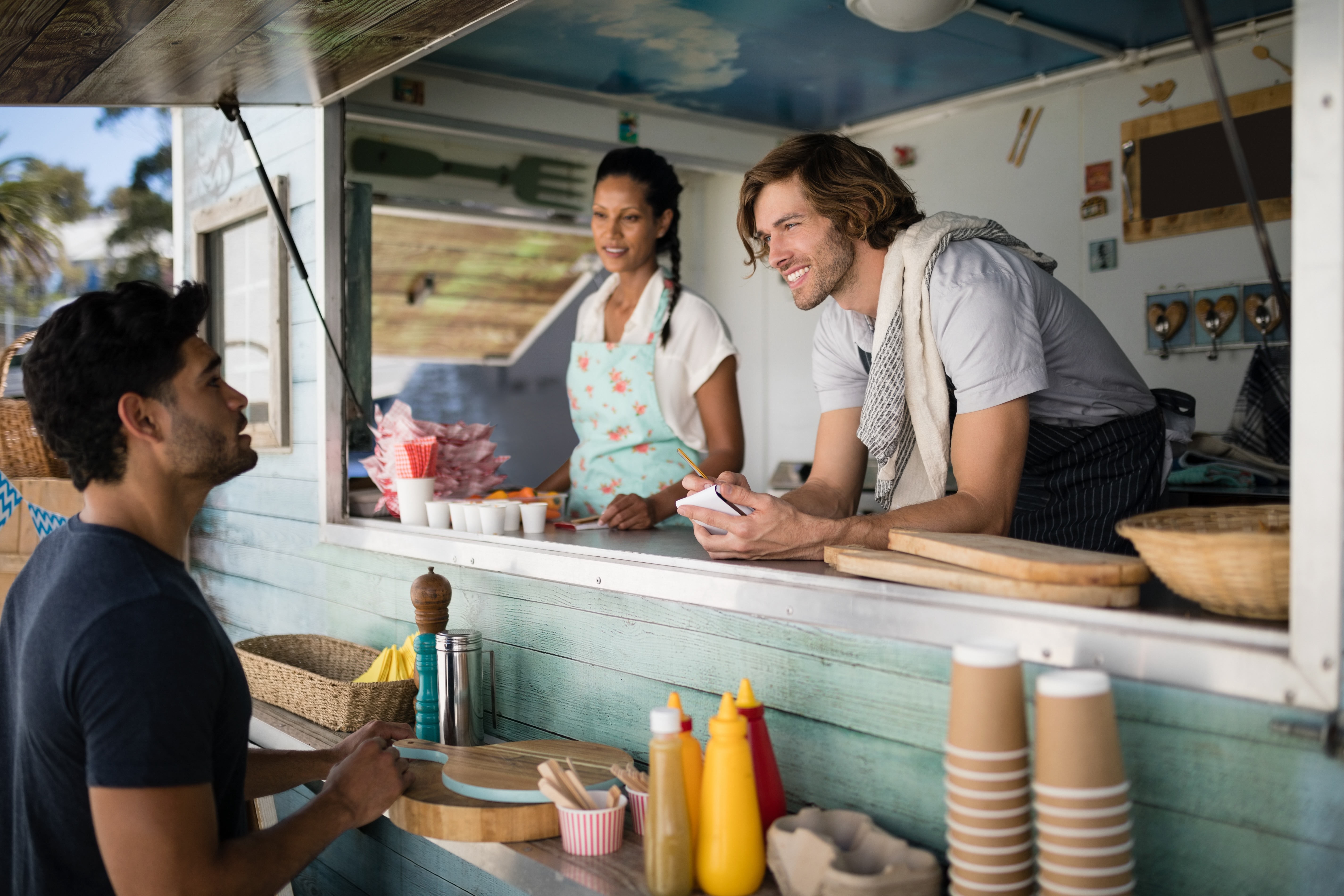 Person ordering at a food truck stock image