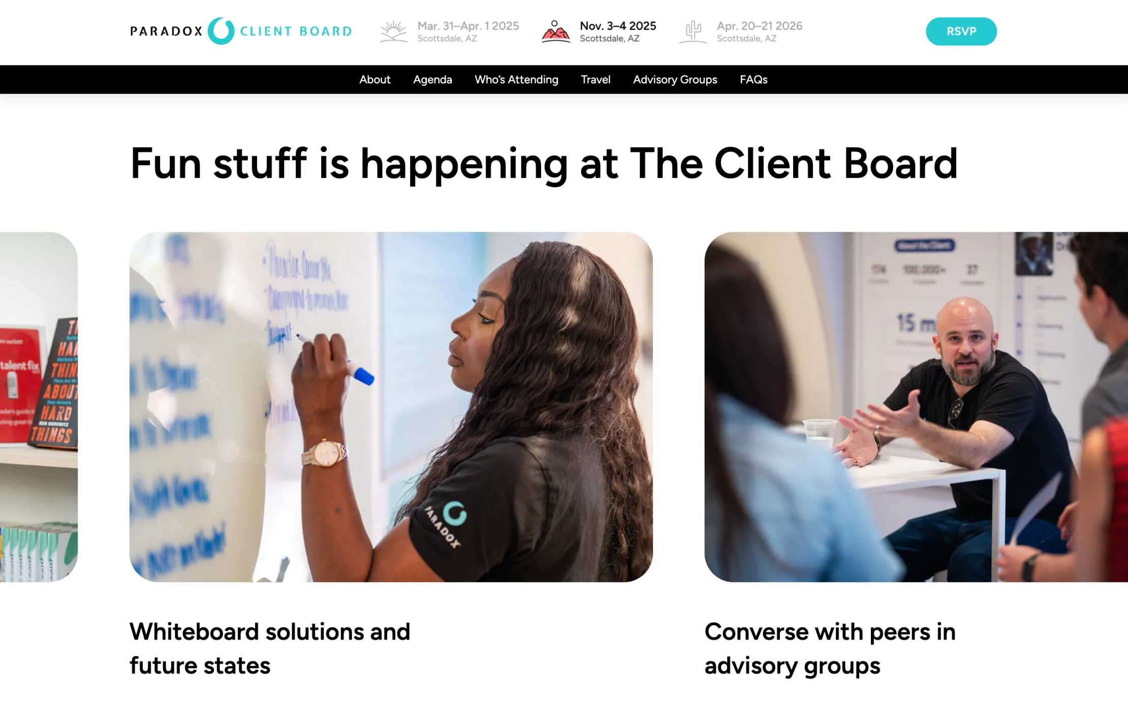 Woman writing on whiteboard with a blue marker, and man discussing with peers at a table.