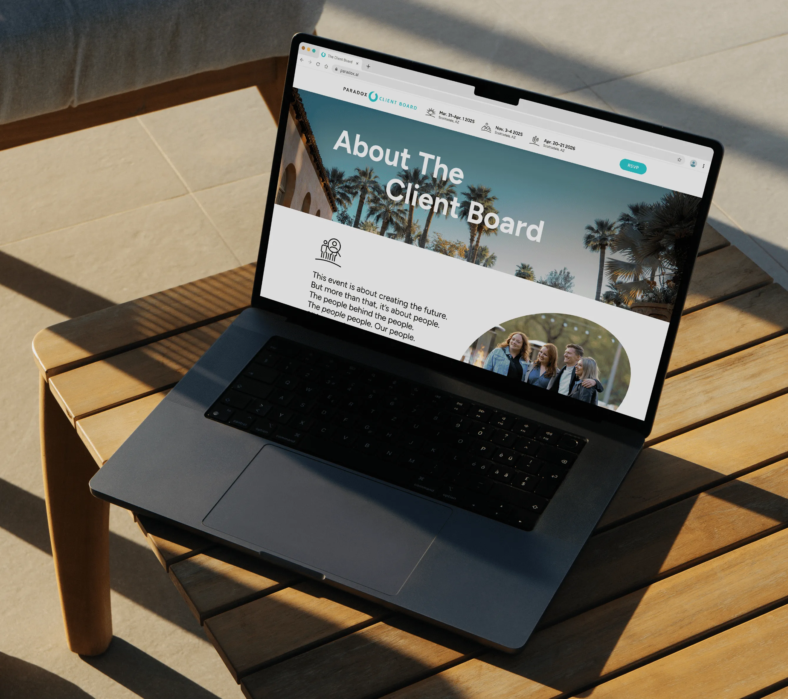Laptop on wooden table showing a webpage titled 'About The Client Board' with palm trees background.