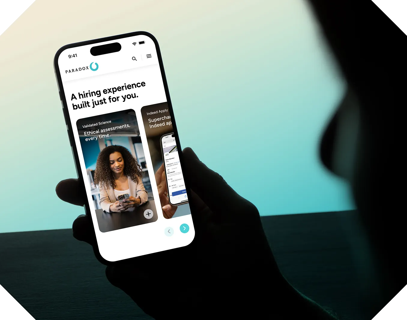 Person holding phone showing Paradox app with text: A hiring experience built just for you.