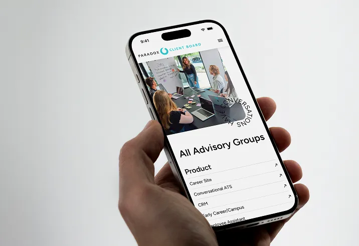 A hand holding an iPhone showing the Paradox Client Board app open to an "All Advisory Groups" list.