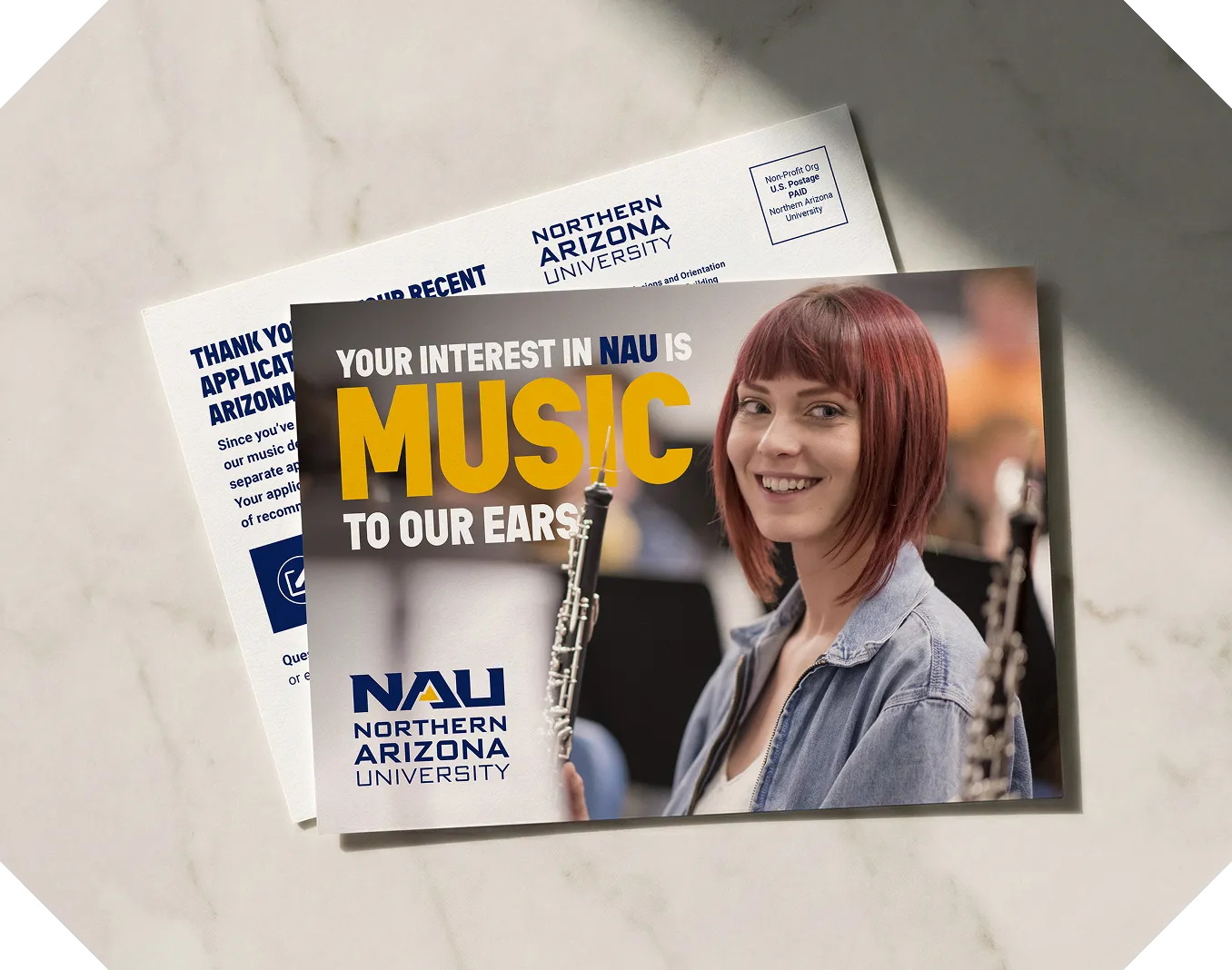 Northern Arizona University postcards, one reading "Your interest in NAU is music to our ears" with a clarinet player.
