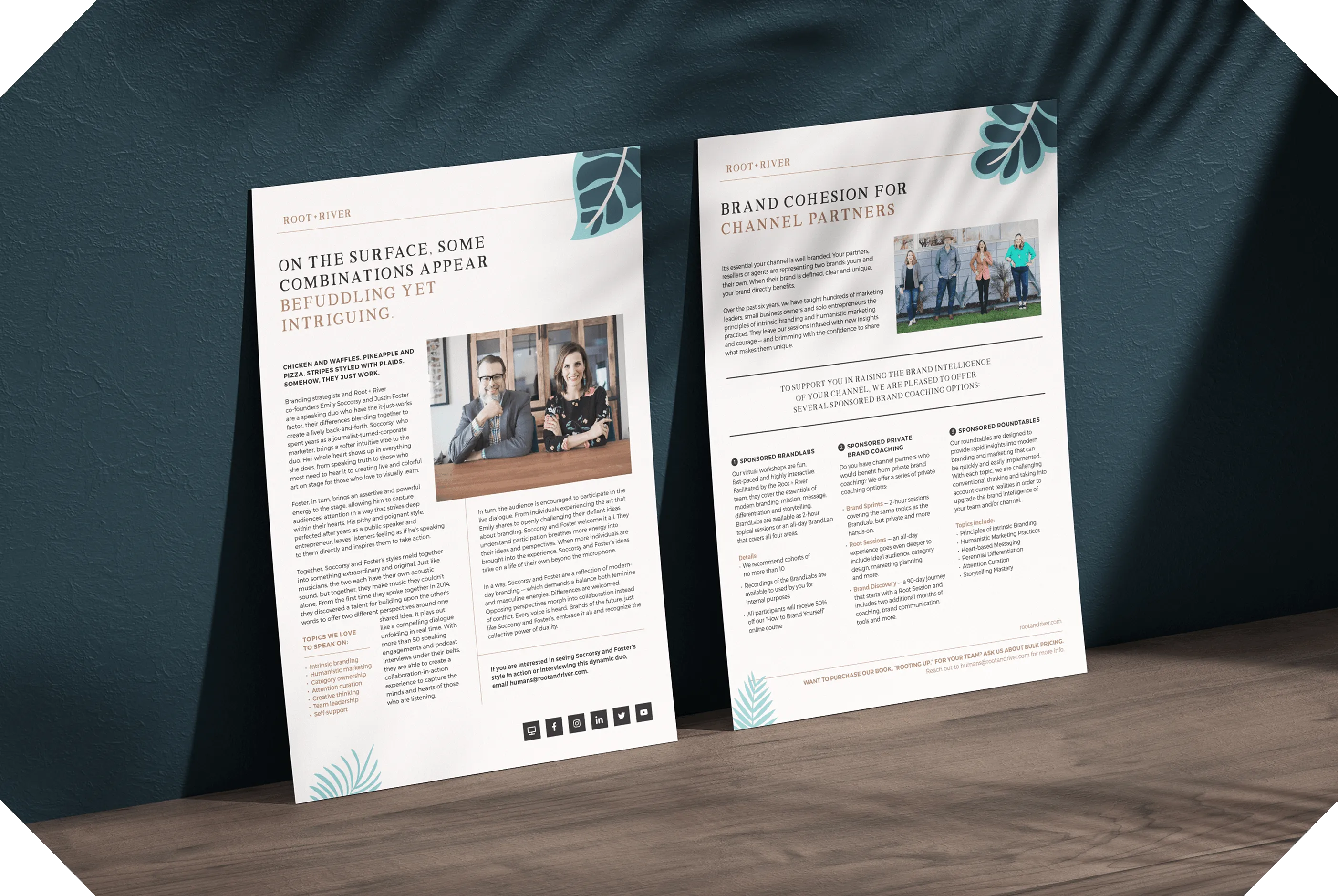Two printed Root + River documents standing against a dark teal backdrop.