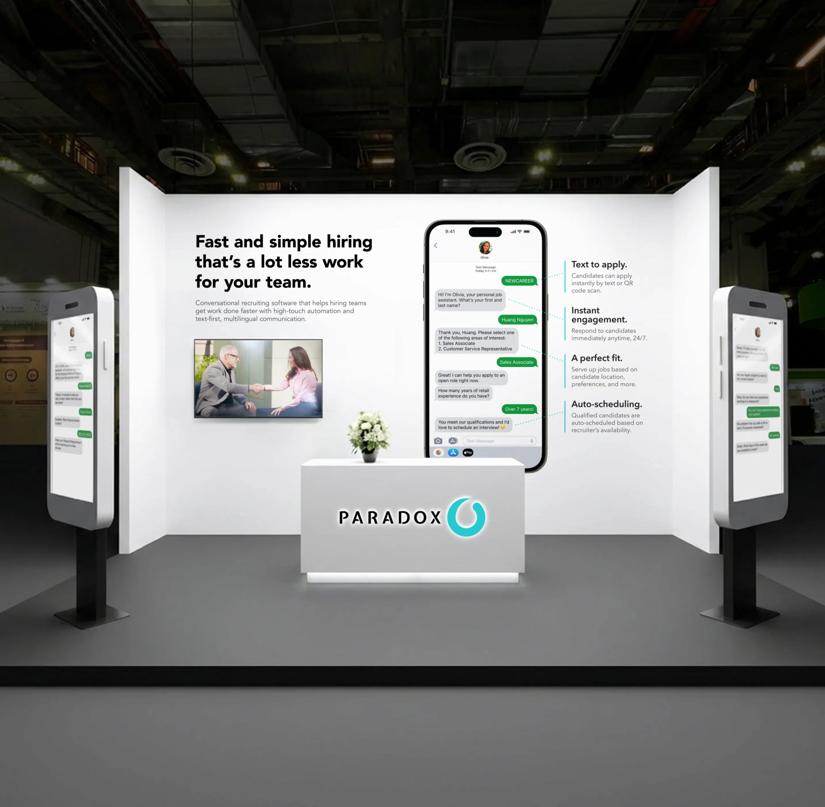 A Paradox trade show booth with backlit panels on fast and simple hiring.
