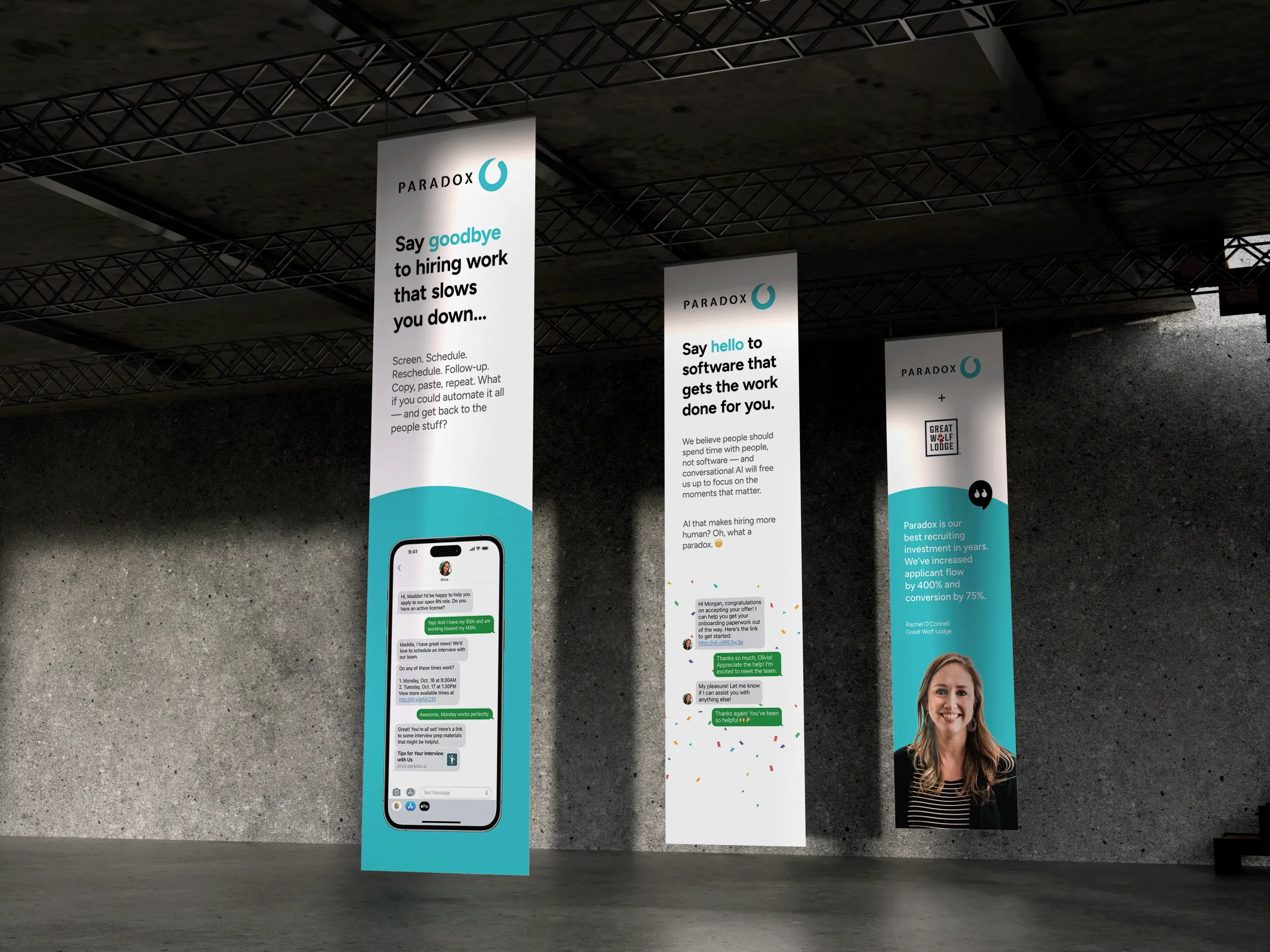 Tall Paradox exhibition banners in a darkened venue, printed with chat screens.