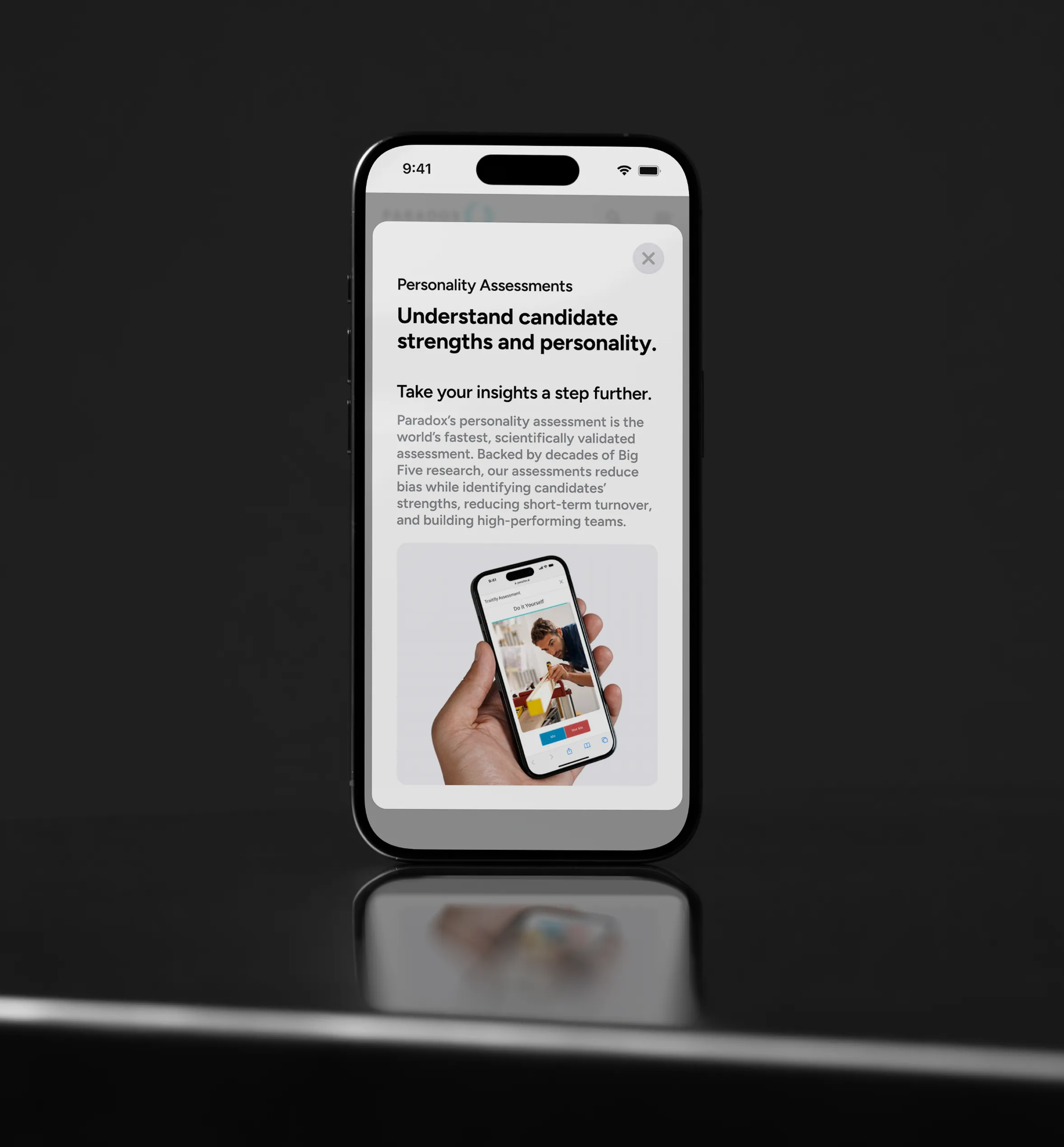 A phone on a dark background displaying a Paradox personality assessment screen.